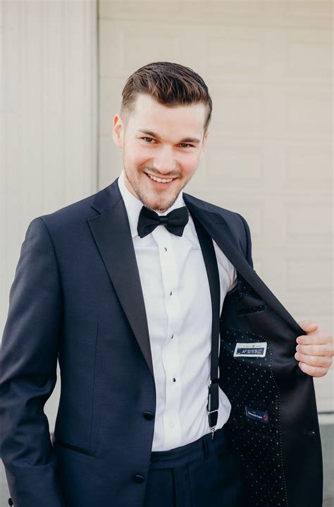 navy suit with black bow tie